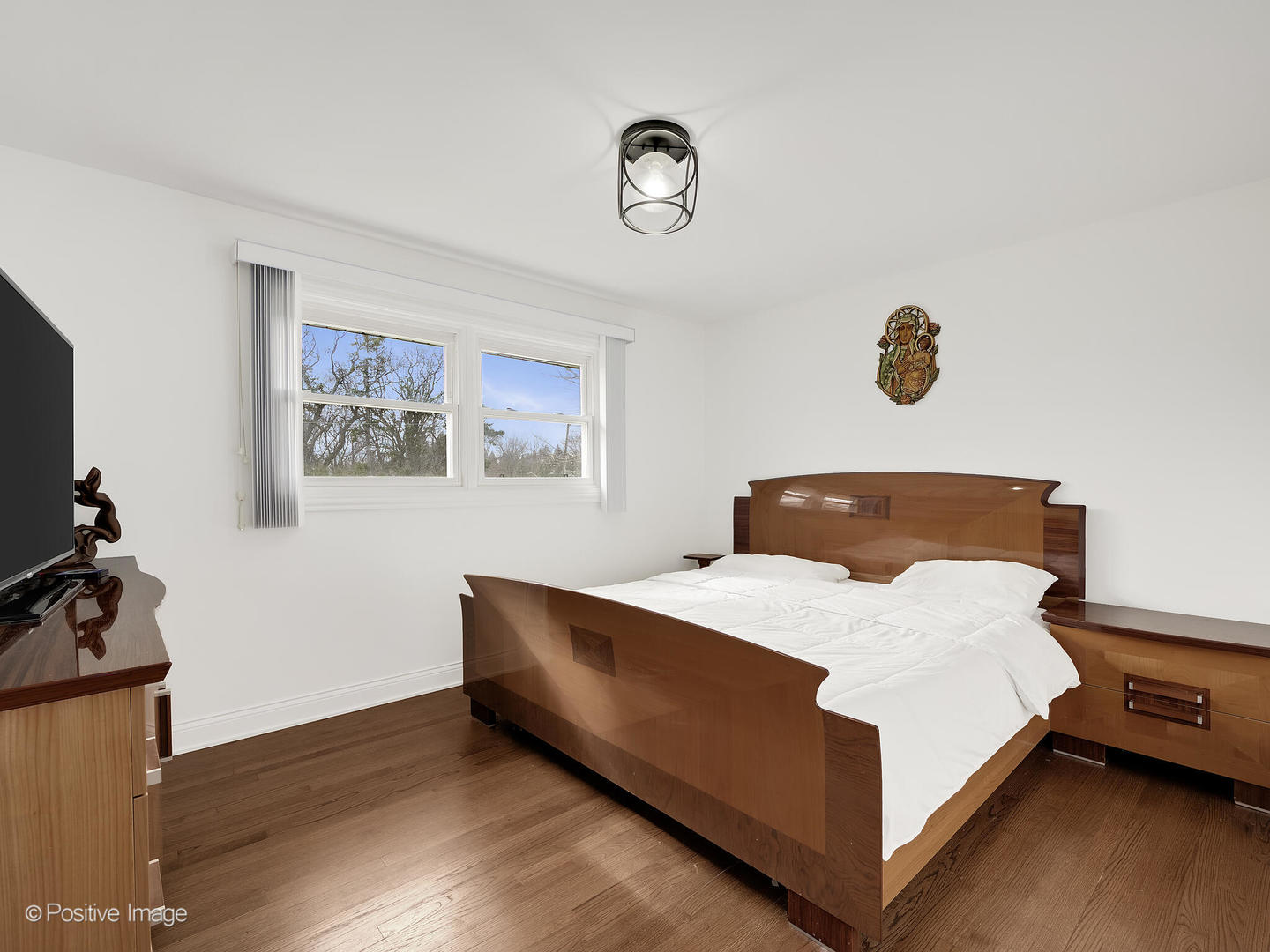 20-w065 South Frontage Road Lemont, IL 60439 - Photo 17 of 30 a bedroom with a bed and a chandelier