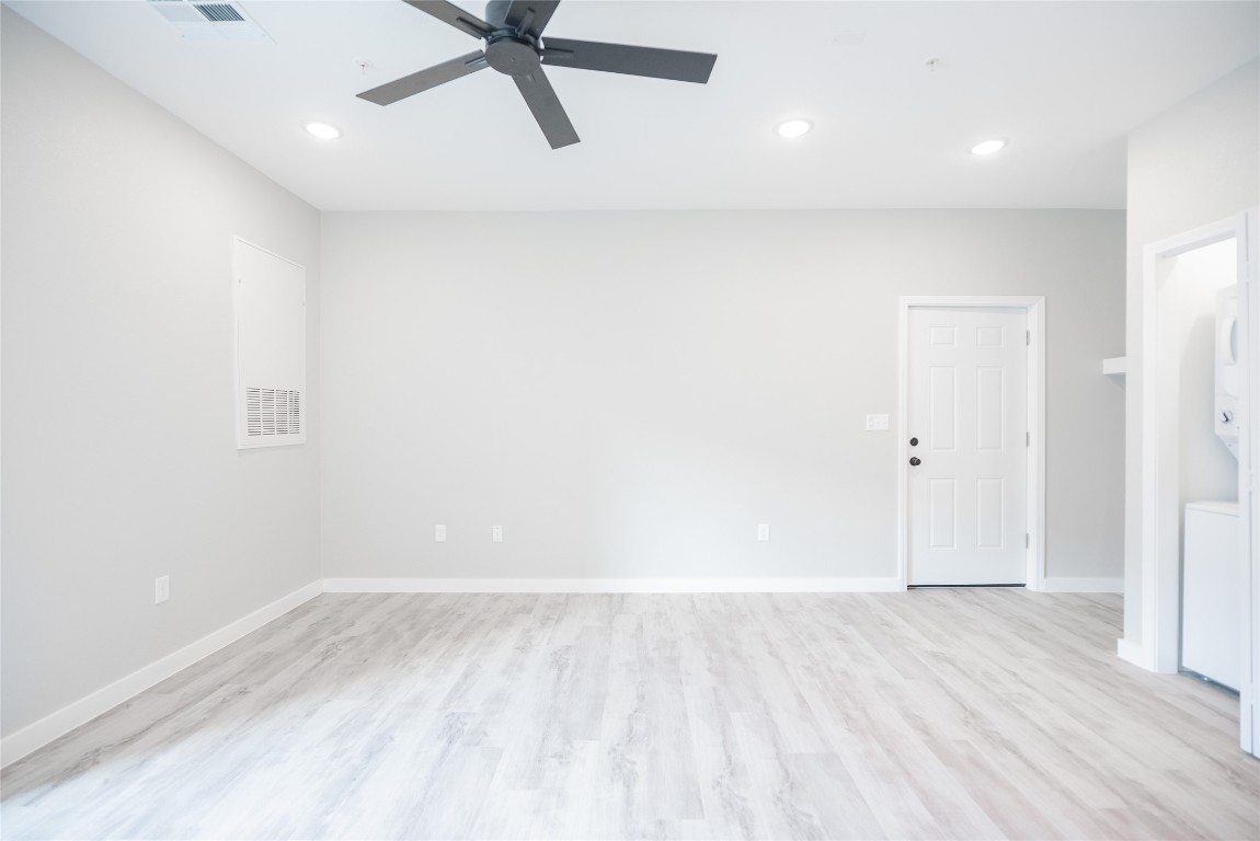 2101 Reinke Road, Unit 8112 Waller, TX 77484 - Photo 12 of 33 a view of a big room with wooden floor and windows in a room