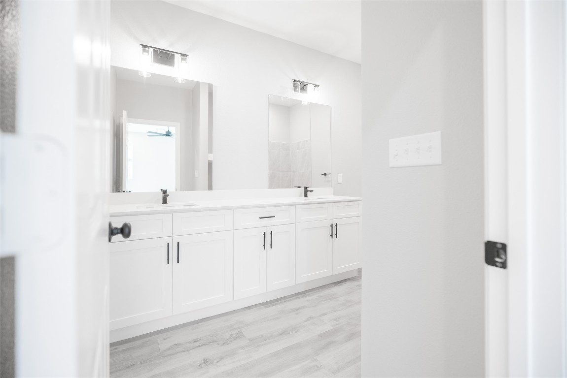 2101 Reinke Road, Unit 8112 Waller, TX 77484 - Photo 19 of 33 a bathroom with a sink and a mirror