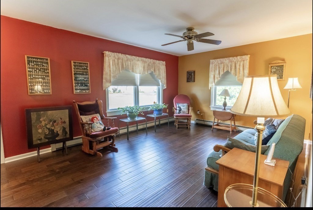 71 Papermill Road Wareham, MA 02576 - Photo 7 of 39 a living room with furniture gym equipment and a large window