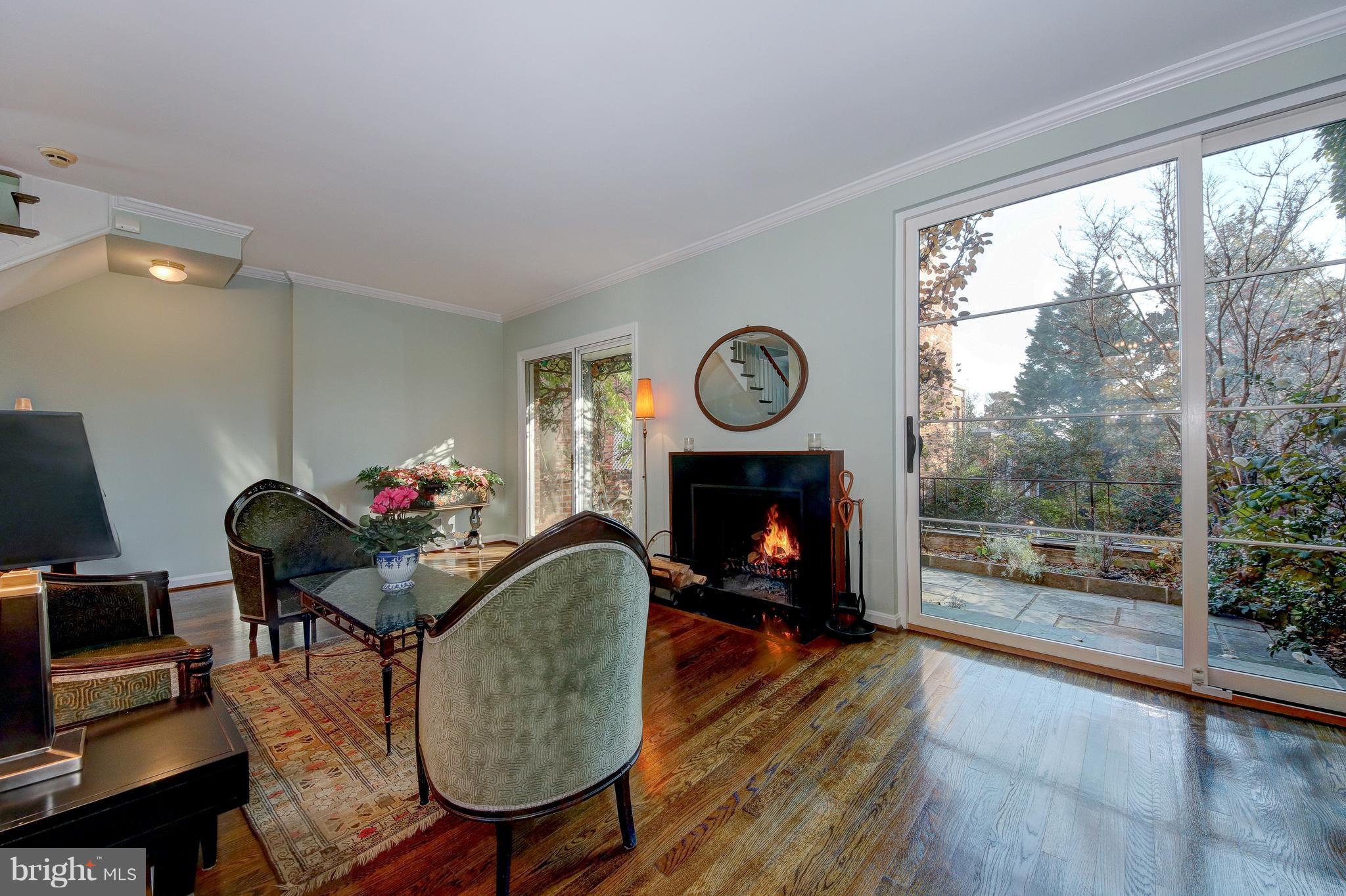 3204 Reservoir Road Northwest Washington, DC 20007 - Photo 7 of 28 Wood burning fireplace & 2 sliding doors to patio