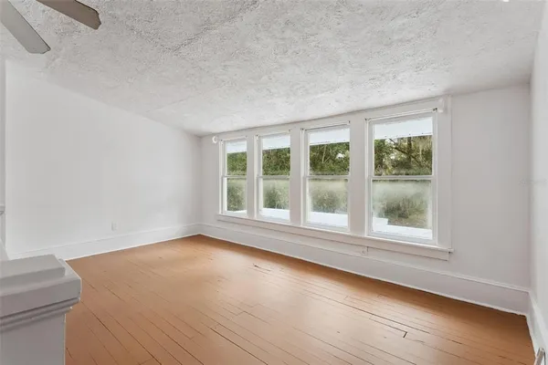 a view of an empty room and a window