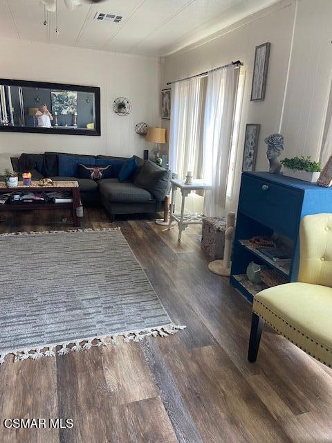 1550 Rory Lane, Unit 159 Simi Valley, CA 93063 - Photo 12 of 24 a living room with furniture and a window