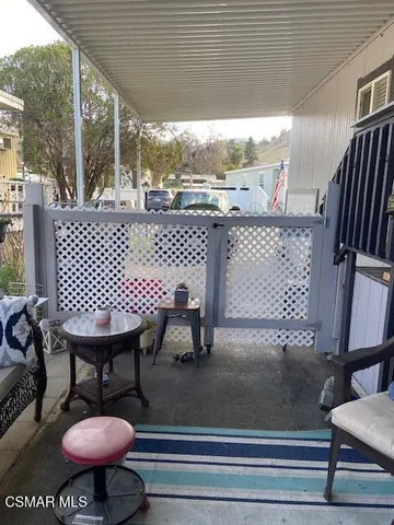 a view of a terrace with furniture