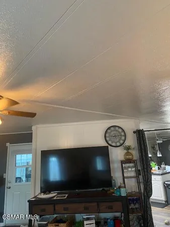 a room with furniture and a flat screen tv