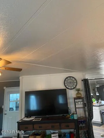 a room with furniture and a flat screen tv