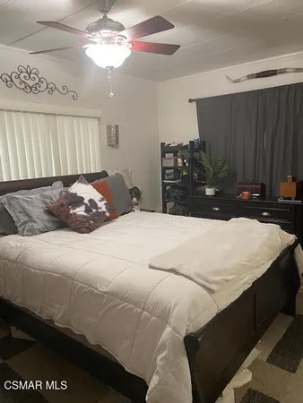 a bedroom with a bed and a closet
