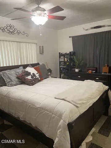 a bedroom with a bed and a closet