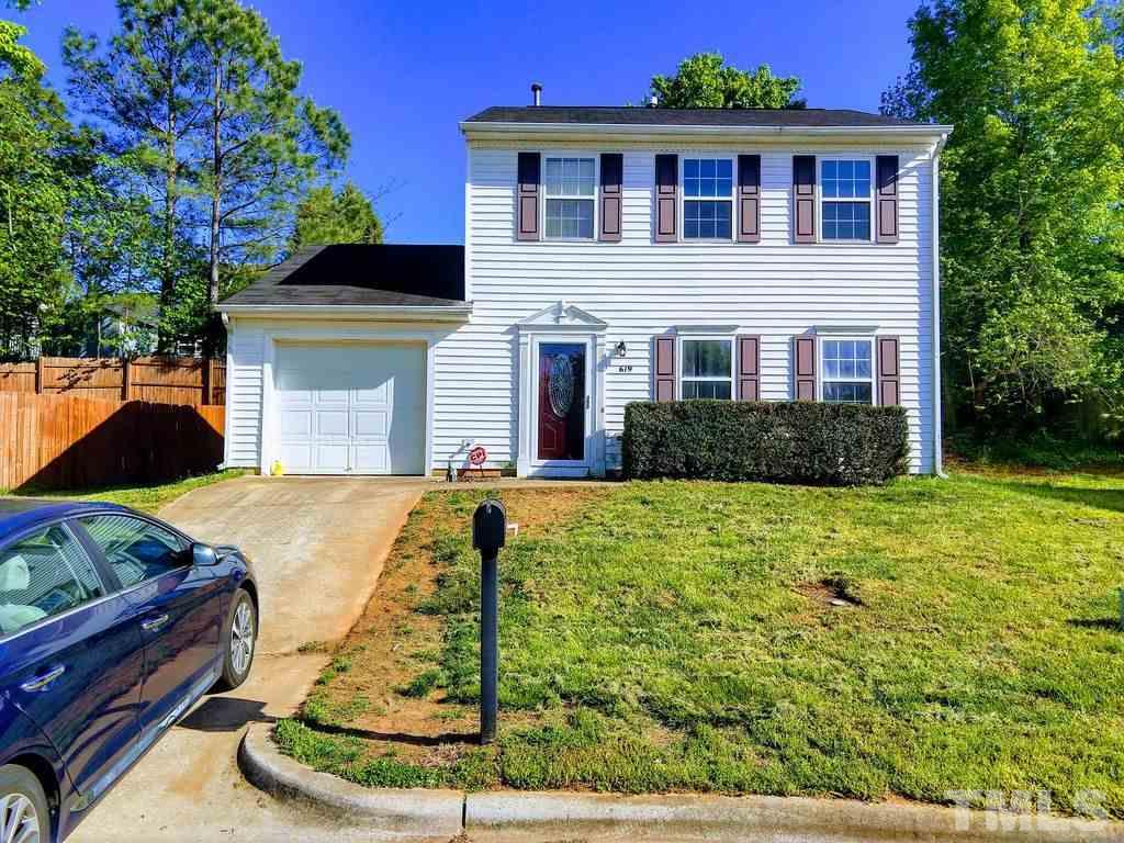619 Parkander Court Raleigh, NC 27603 - Photo 1 of 6 a front view of house with yard and trees in the background