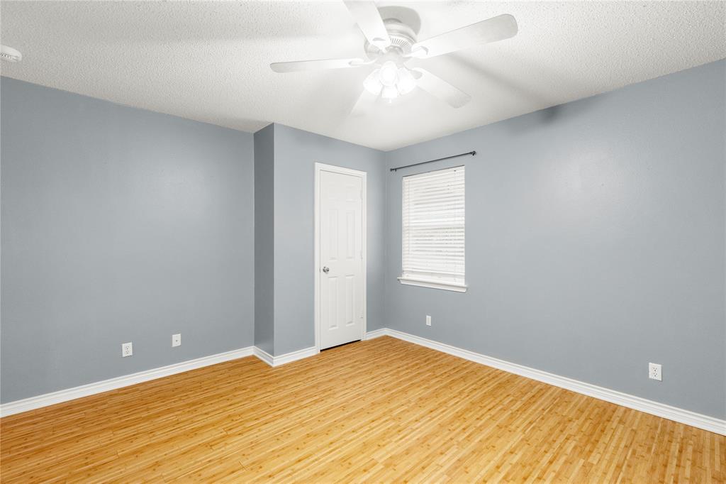 2917 Harlow Road Commerce, TX 75428 - Photo 27 of 40 a view of empty room with wooden floor