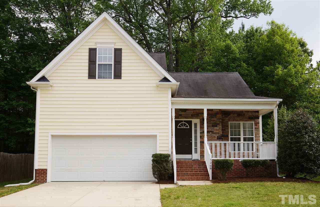 5209 Groveside Court Raleigh, NC 27613 - Photo 1 of 25 a view of a house with a yard