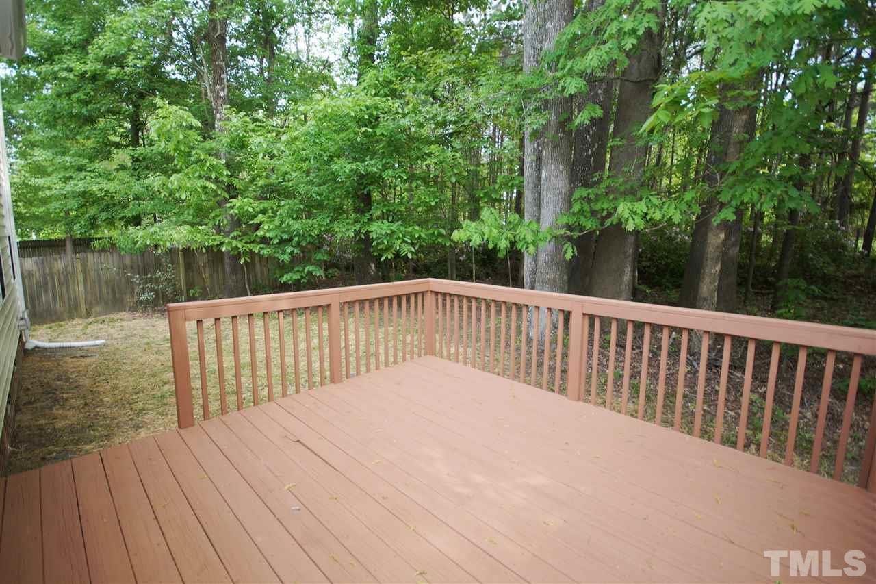 5209 Groveside Court Raleigh, NC 27613 - Photo 23 of 25 a balcony with trees in front of it