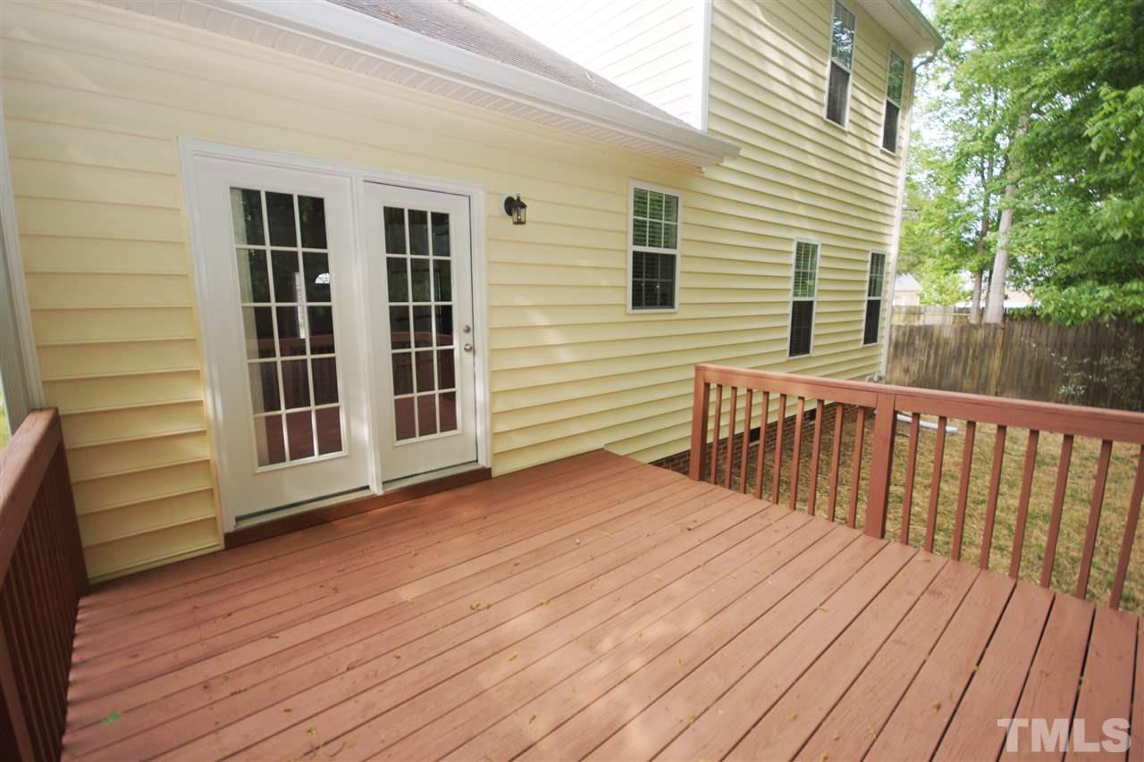 5209 Groveside Court Raleigh, NC 27613 - Photo 24 of 25 a view of a wooden deck
