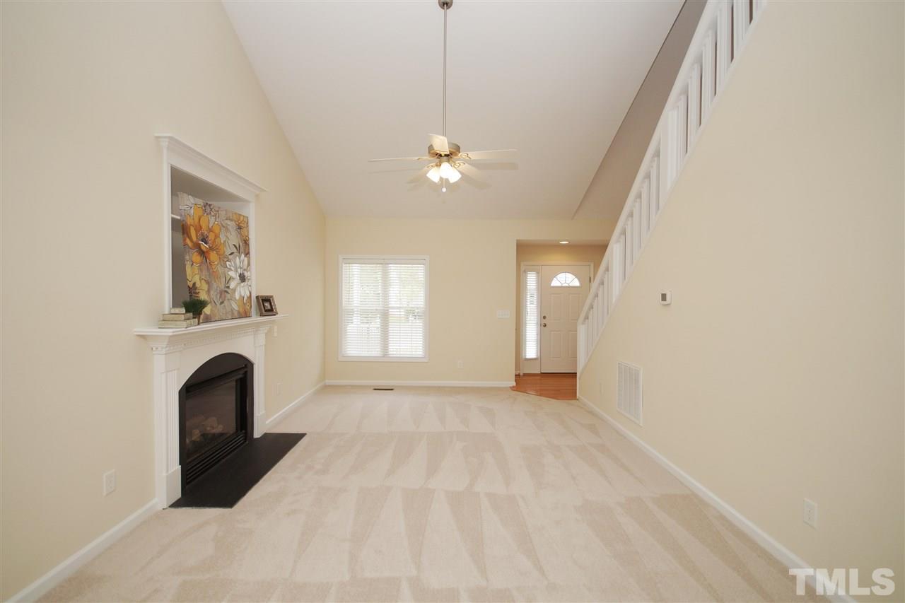 5209 Groveside Court Raleigh, NC 27613 - Photo 8 of 25 a view of a livingroom with a fireplace and window