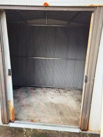 a view of a house with wooden floor and iron stairs