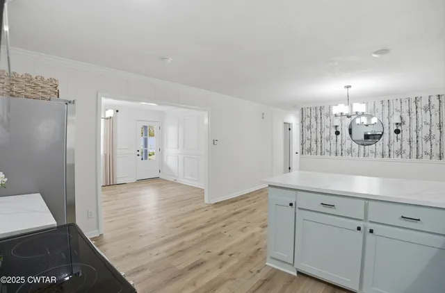 a view of a kitchen cabinets and wooden floor