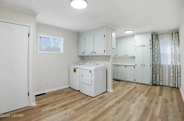 a view of a kitchen with wooden floor