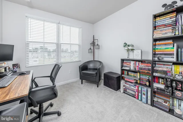 a work room with furniture and a window