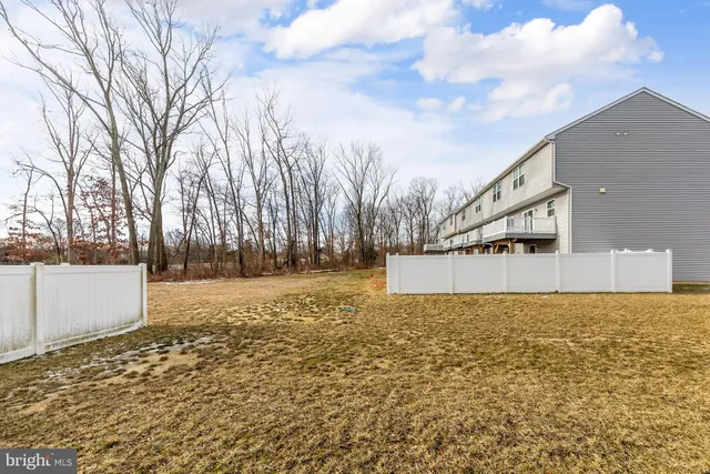 a view of a yard with trees