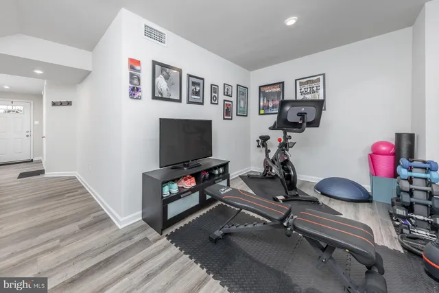 a room with furniture and a flat screen tv