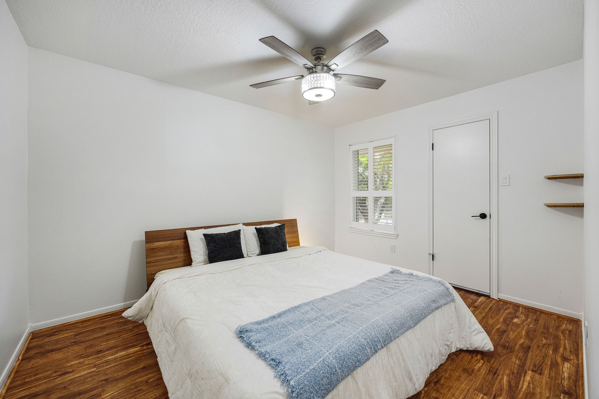 727 Bunker Hill Road, Unit 26 Houston, TX 77024 - Photo 20 of 25 This secondary bedroom is located at the front of the home and comfortable enough to fit a king-size bed and side tables, if desired.
