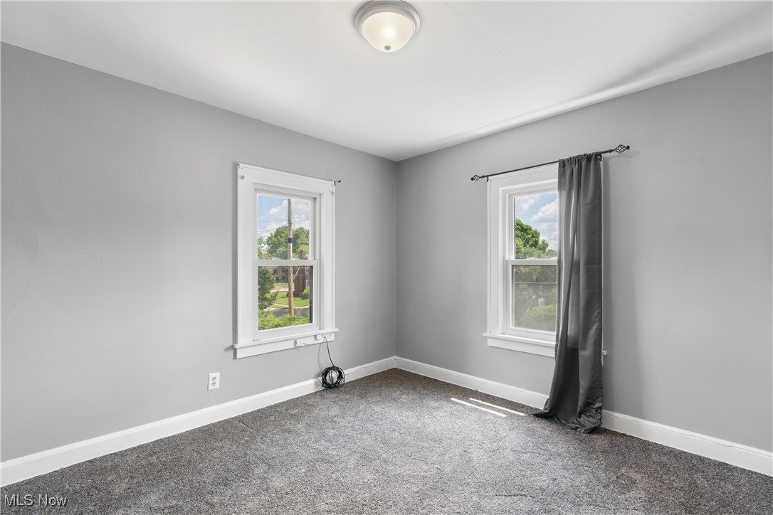 302 Poplar Avenue Northwest Canton, OH 44708 - Photo 20 of 34 Empty room featuring carpet floors and baseboards