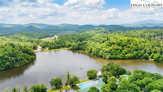 an aerial view of a houses with lake view
