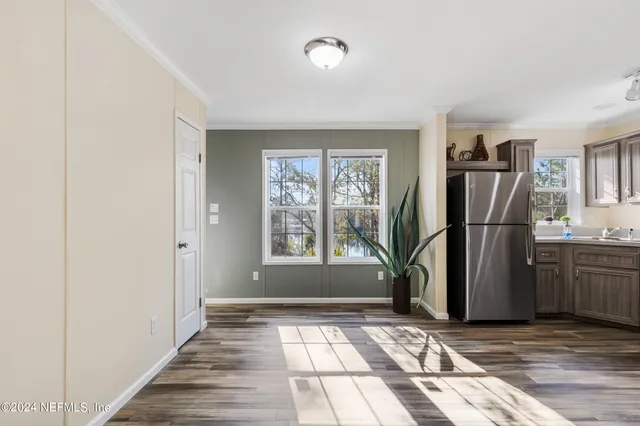 a spacious bedroom with a bed and a window