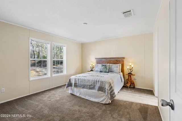 a bathroom with a sink double vanity granite and a bathtub