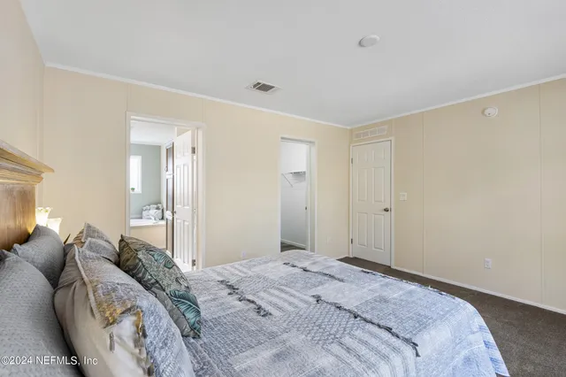 a bathroom with a double vanity sink and mirror