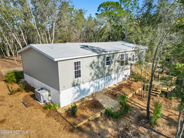 a view of a small yard and furniture
