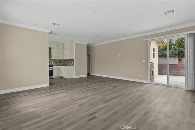 a view of a kitchen with a sink and dishwasher wooden floor