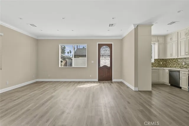 wooden floor in an empty room and a window