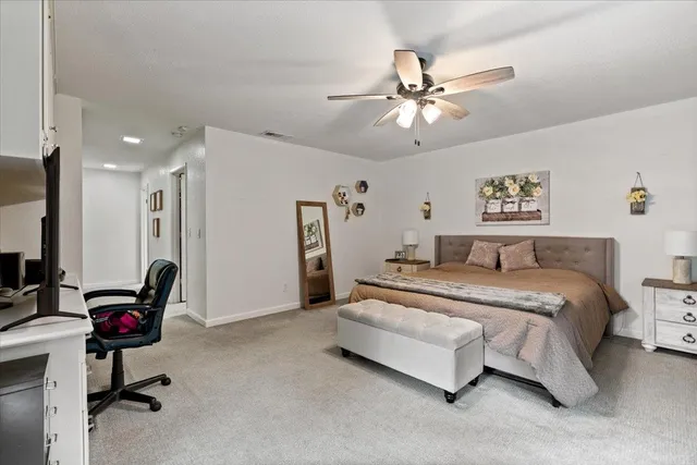 a spacious bathroom with stainless steel appliances granite countertop a sink and a cabinets