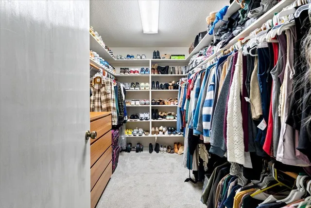 a bathroom with a double vanity sink toilet and shower