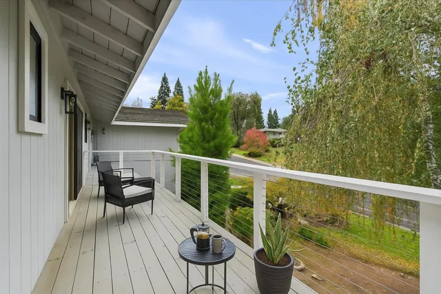 an aerial view of a house with swimming pool garden and patio