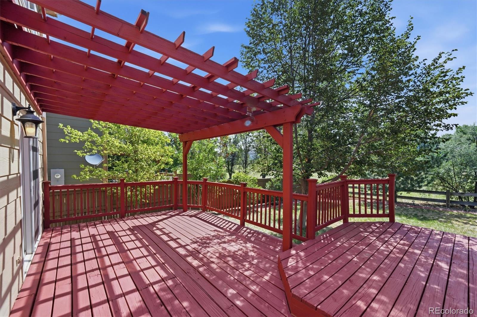 9629 Burberry Way Highlands Ranch, CO 80129 - Photo 36 of 50 a view of a backyard with a deck