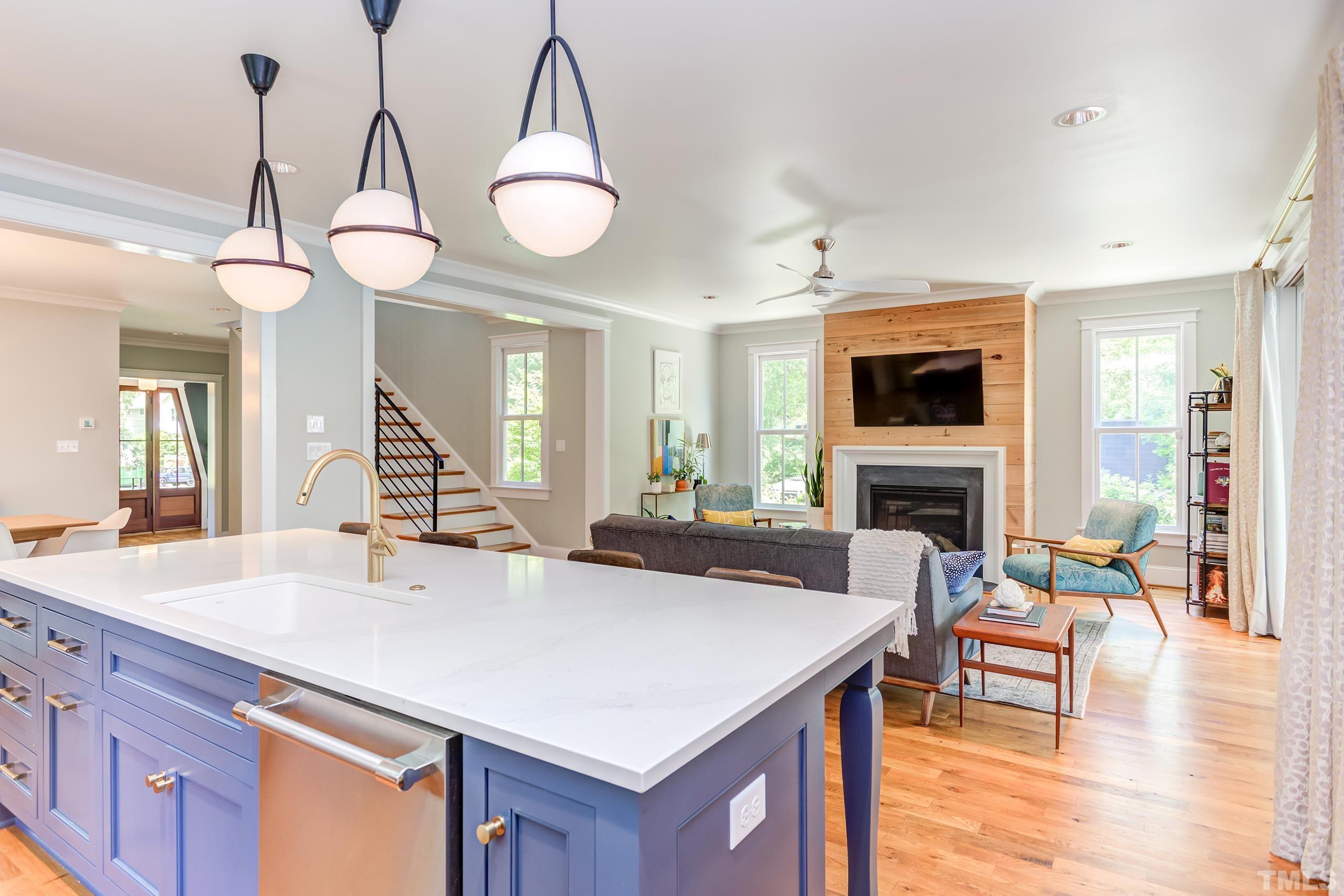 2709 North Mayview Road Raleigh, NC 27607 - Photo 12 of 66 a living room with furniture a fireplace and a flat screen tv