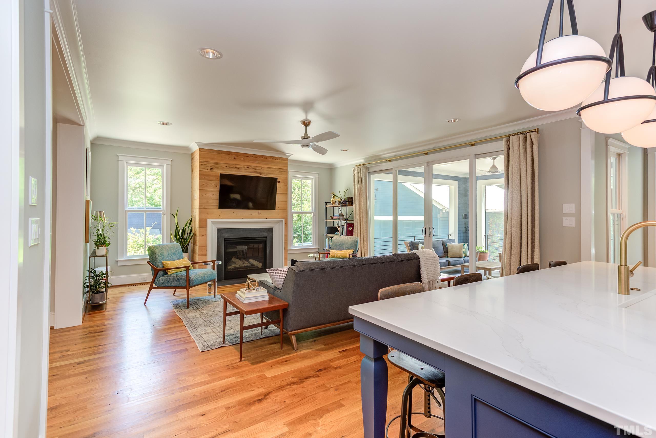 2709 North Mayview Road Raleigh, NC 27607 - Photo 14 of 66 a living room with fireplace furniture and a large window