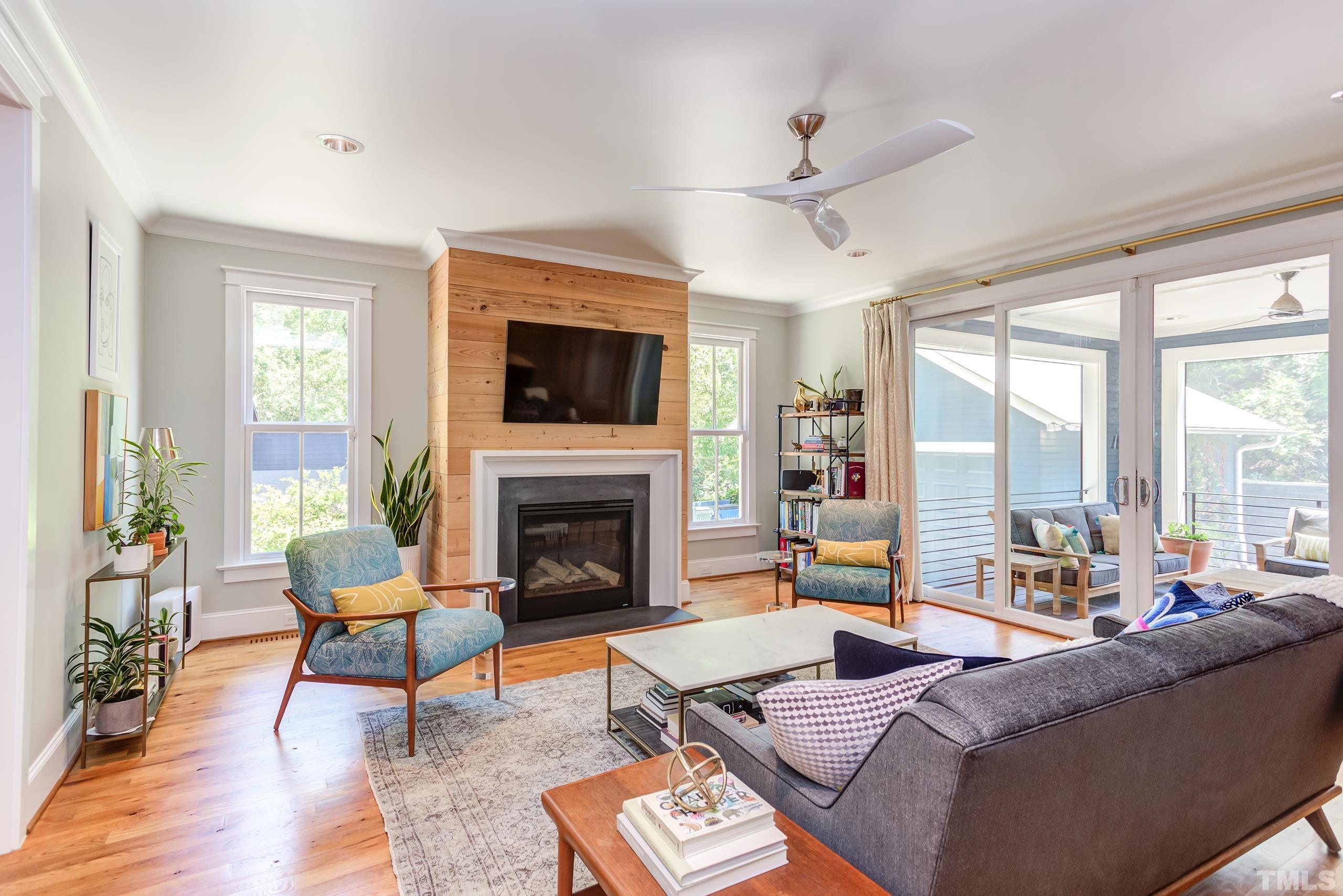 2709 North Mayview Road Raleigh, NC 27607 - Photo 17 of 66 a living room with furniture fireplace and a large window