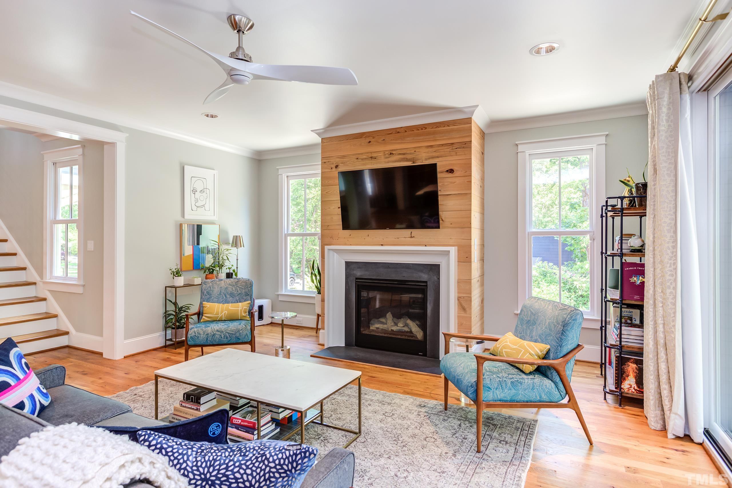 2709 North Mayview Road Raleigh, NC 27607 - Photo 20 of 66 a living room with furniture a flat screen tv and a fireplace