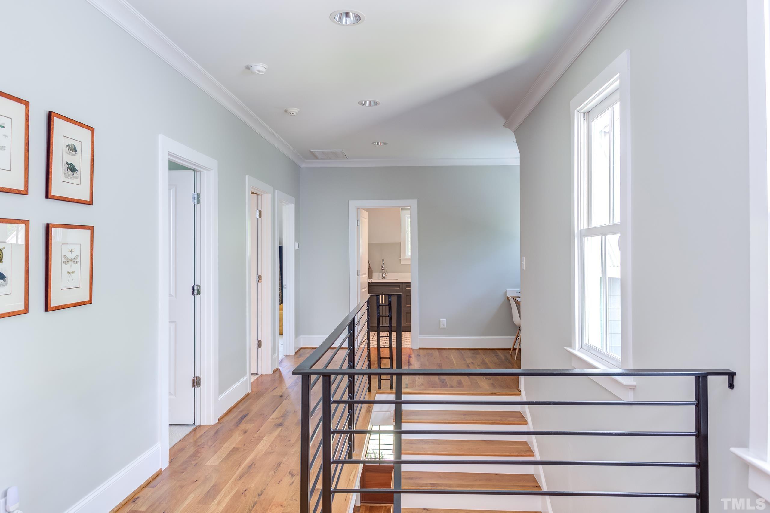 2709 North Mayview Road Raleigh, NC 27607 - Photo 25 of 66 a view of entryway with wooden floor and stairs