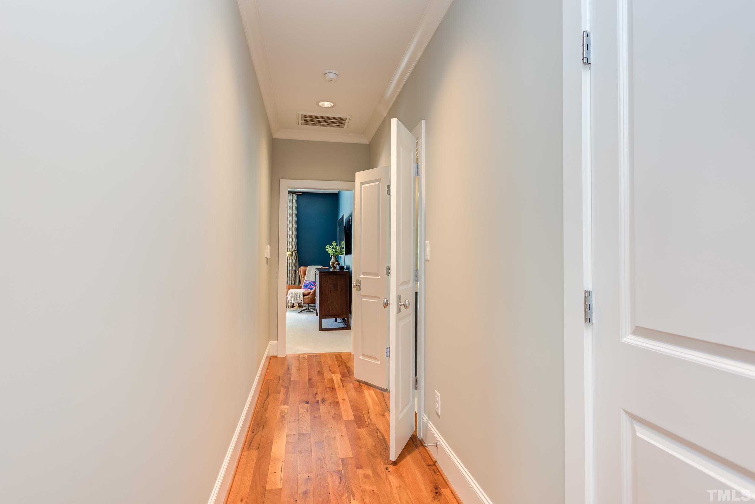 2709 North Mayview Road Raleigh, NC 27607 - Photo 28 of 66 a view of a hallway with wooden floor