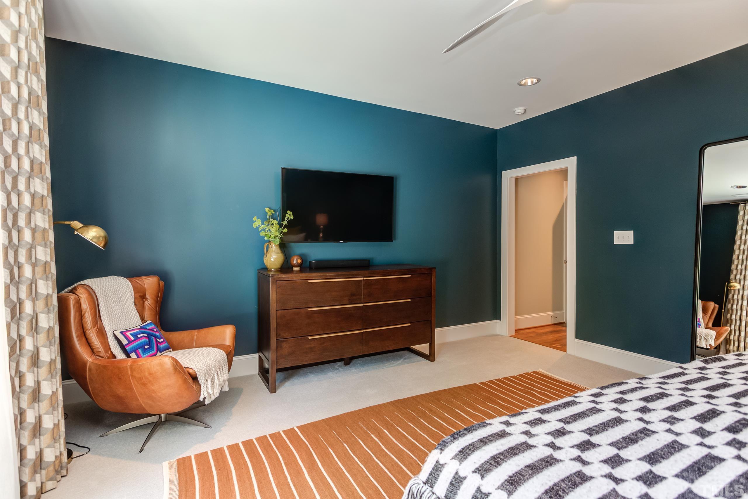 2709 North Mayview Road Raleigh, NC 27607 - Photo 31 of 66 a bedroom with furniture and a flat screen tv