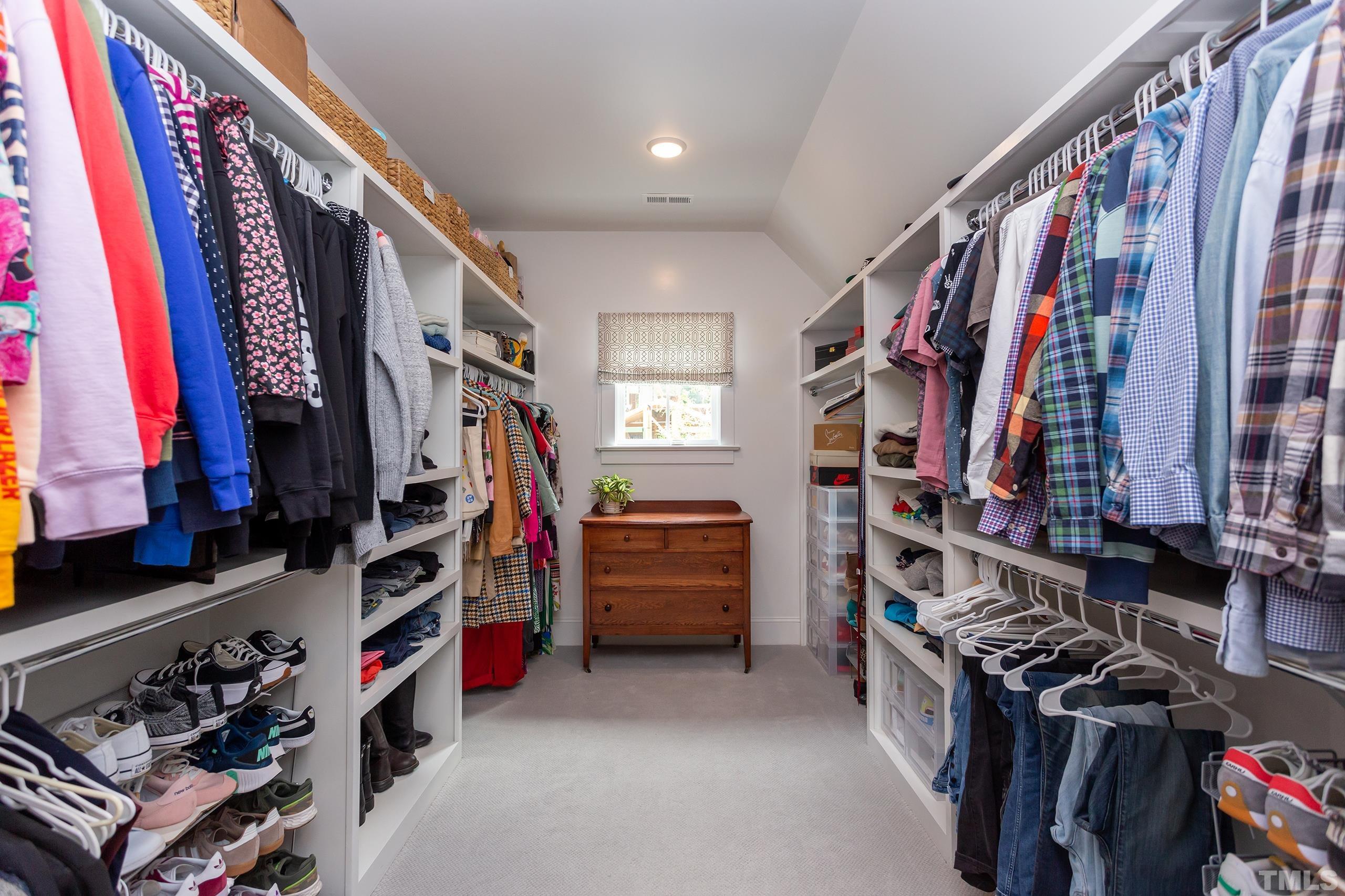 2709 North Mayview Road Raleigh, NC 27607 - Photo 37 of 66 a view of walk in closet with clothes and shoes