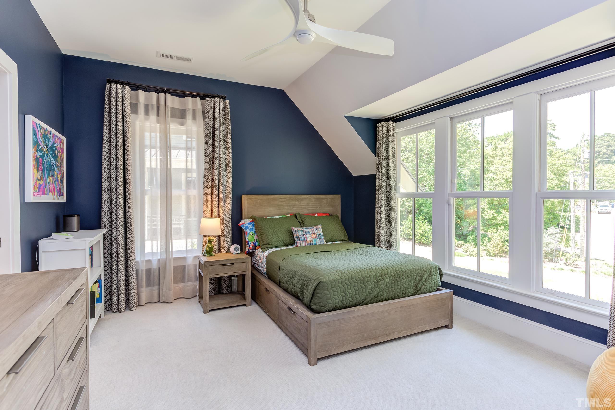2709 North Mayview Road Raleigh, NC 27607 - Photo 44 of 66 a living room with a bed furniture and a large window