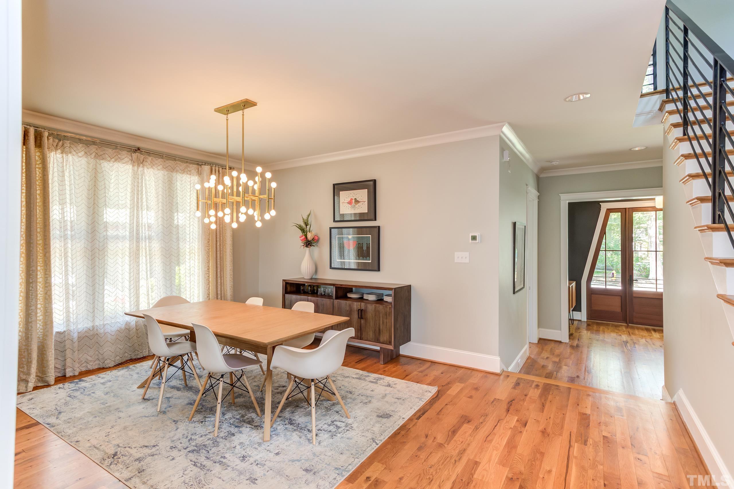 2709 North Mayview Road Raleigh, NC 27607 - Photo 7 of 66 a view of a dining room with furniture window and wooden floor