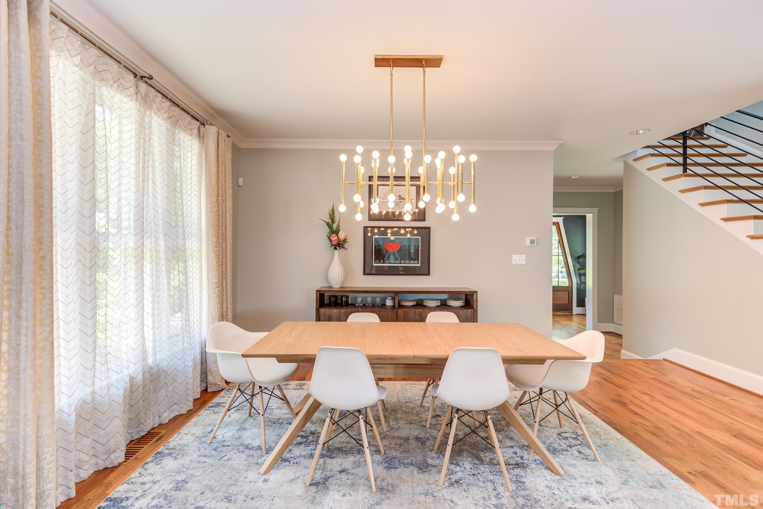 2709 North Mayview Road Raleigh, NC 27607 - Photo 8 of 66 a view of a dining room with furniture and chandelier