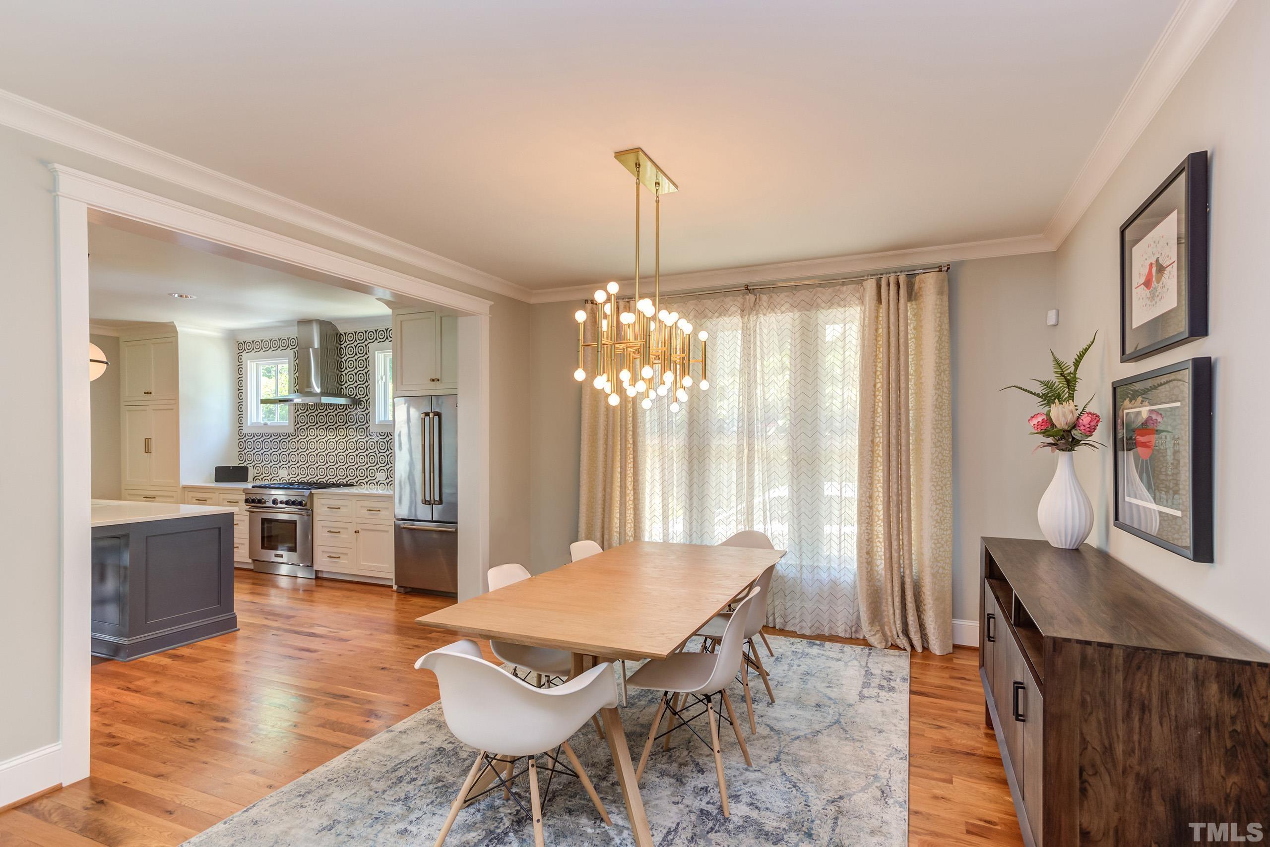 2709 North Mayview Road Raleigh, NC 27607 - Photo 9 of 66 a view of a dining room with furniture window and wooden floor