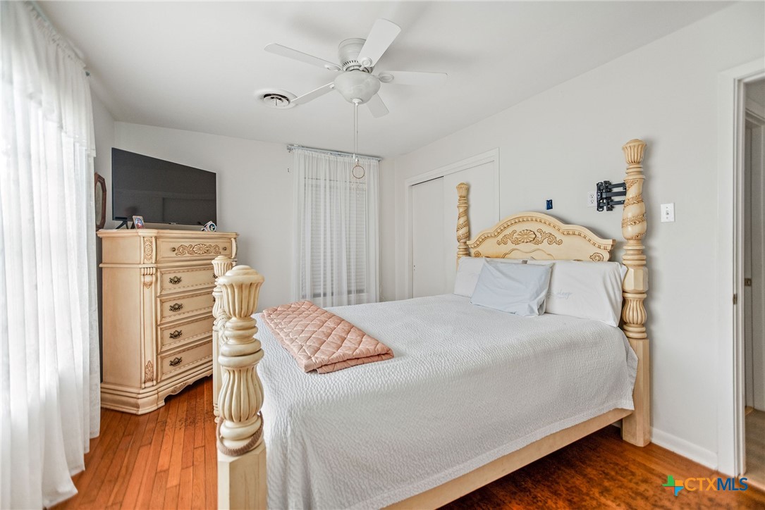 207 Williams Street Tivoli, TX 77990 - Photo 20 of 32 a bedroom with a bed and flat screen tv